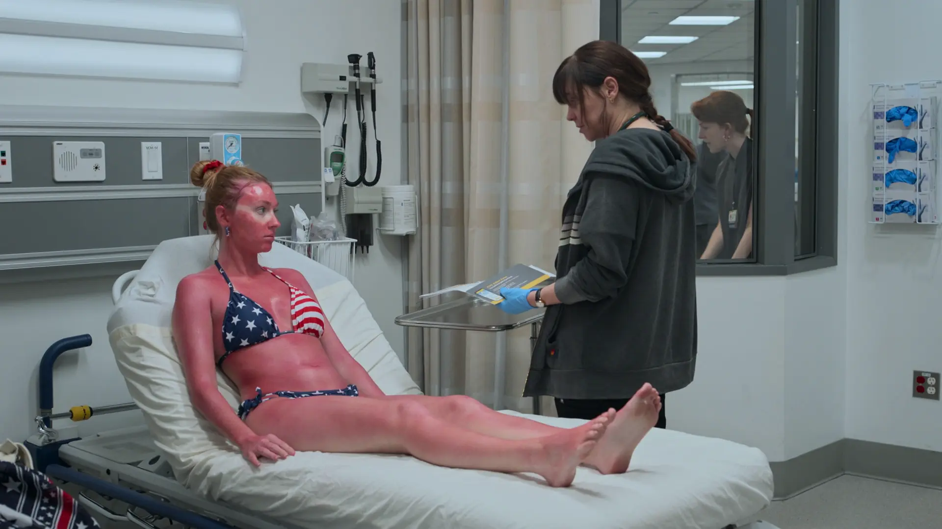 Dr. McKay counseling Ms. Stevens on outpatient sunburn care.